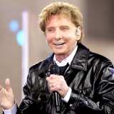 Barry Manilow performs in the rain on NBC"s "Today" Show at Rockefeller Plaza on April 20, 2017 in New York City.