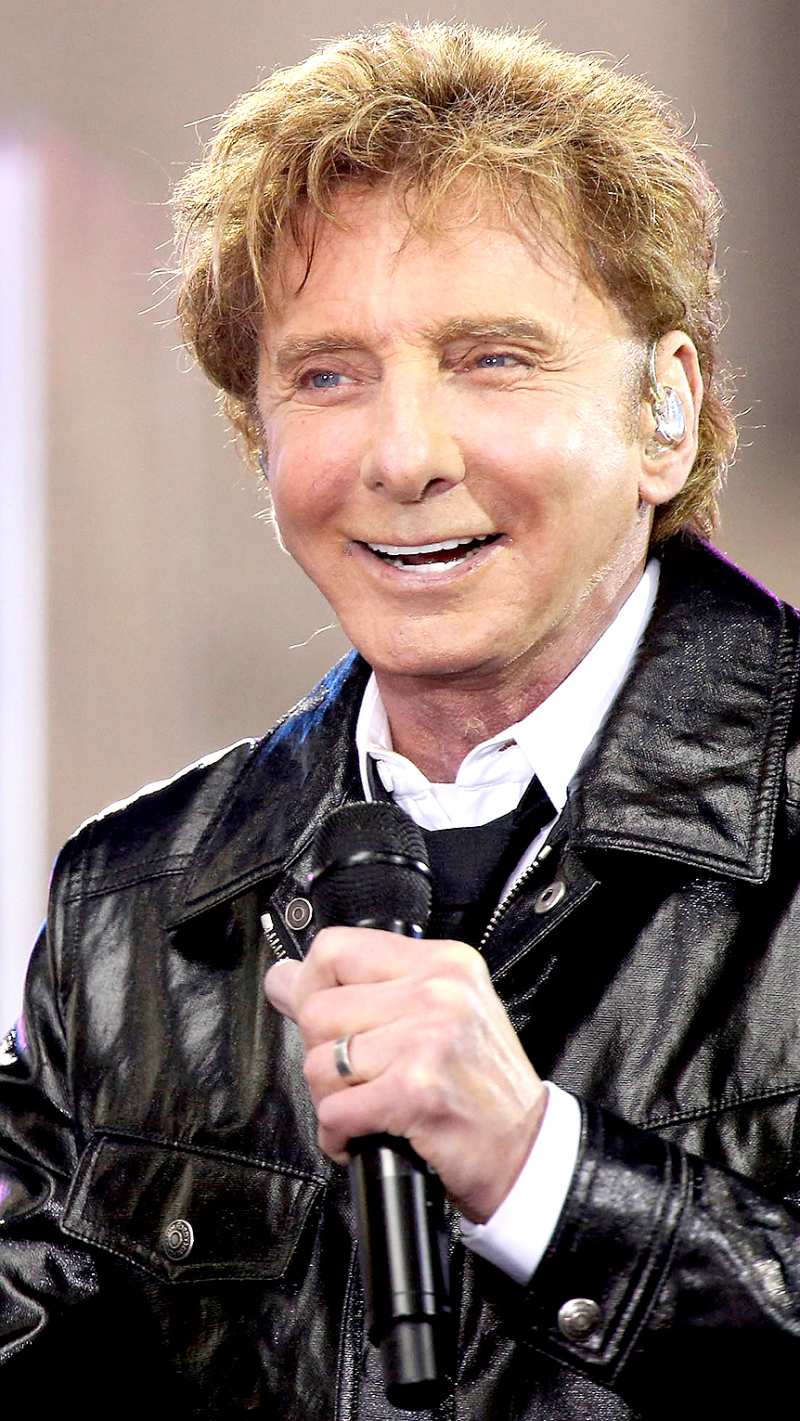 Barry Manilow performs in the rain on NBC