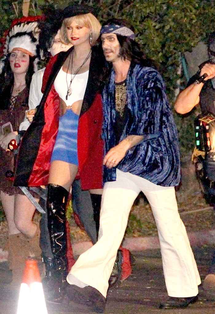 Adam Levine and Behati Prinsloo arrived at the Maroon 5 annual Halloween party Adam Levine dressed as Led Zeppelin and Behati dressed as Julia Roberts in pretty woman.