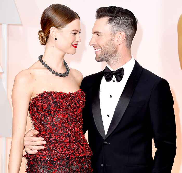 Adam Levine (R) and Behati Prinsloo attend the 87th Annual Academy Awards at Hollywood & Highland Center on February 22, 2015 in Hollywood, California.