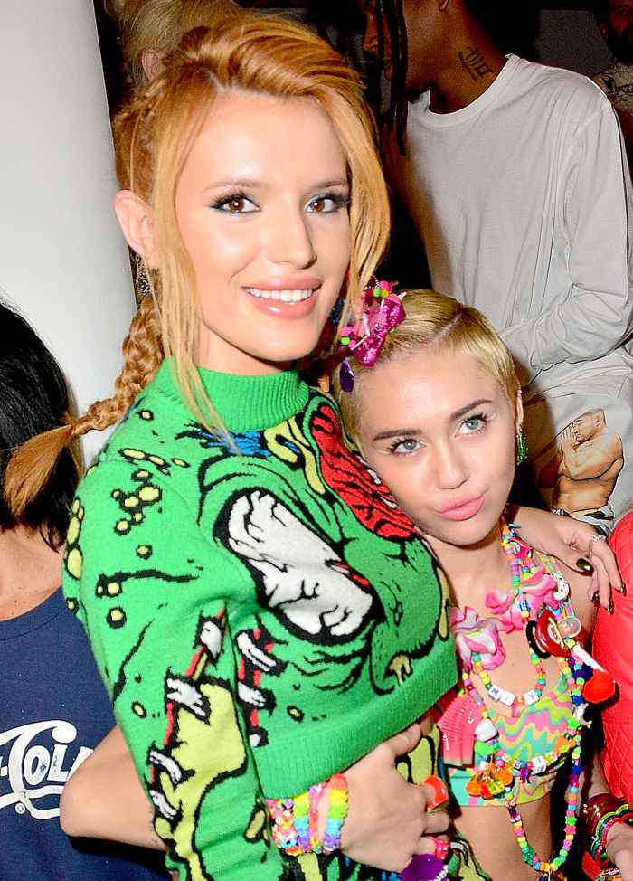 Bella Thorne and Miley Cyrus attend Jeremy Scott during MADE Fashion Week Spring 2015 at Milk Studios on September 10, 2014 in New York City.