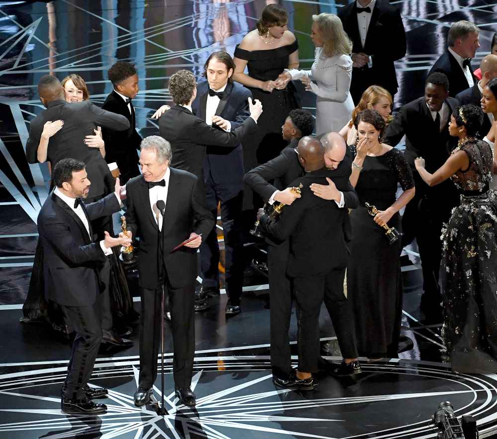 Actor Warren Beatty (C) explains a presentation error which resulted in Best Picture being announced as 'La La Land' instead of 'Moonlight' onstage during the 89th Annual Academy Awards at Hollywood & Highland Center on February 26, 2017