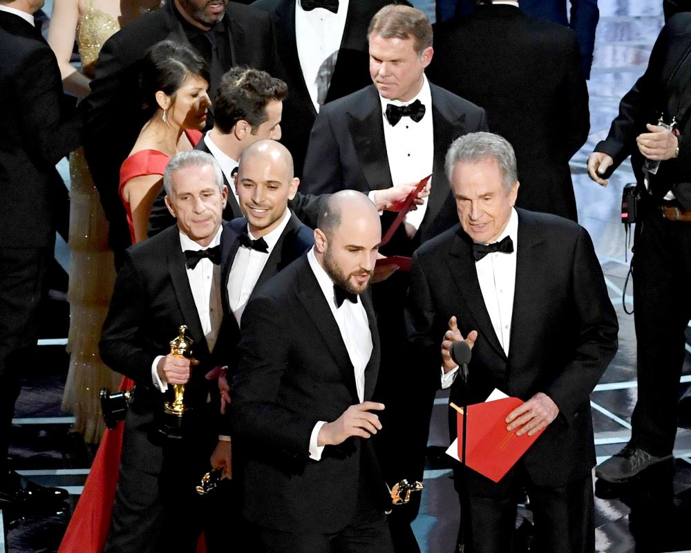 'La La Land' producer Jordan Horowitz (L) announces actual Best Picture winner as 'Moonlight' after a presentation error with actor Warren Beatty onstage during the 89th Annual Academy Awards at Hollywood & Highland Center on February 26, 2017 in Hollywood, California.