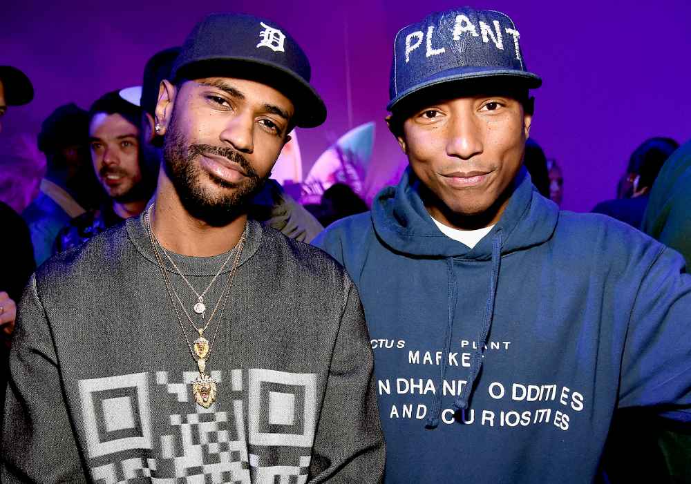 Rapper Big Sean and singer-songwriter Pharrell Williams attend adidas Originals Pink Beach Pharrell Williams party on May 13, 2016 in West Hollywood, California.