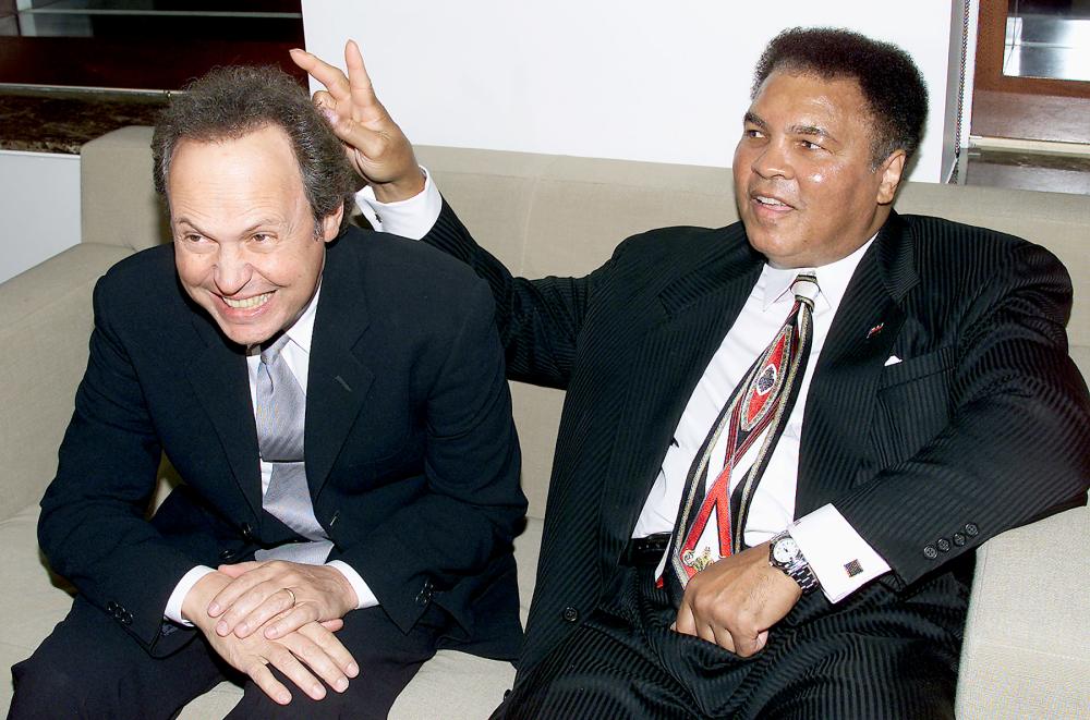 Billy Crystal and Muhammad Ali at Audemars Piguet's Time to Give Celebrity Watch Auction for Charity, held at Christie's in NYC in 2000.