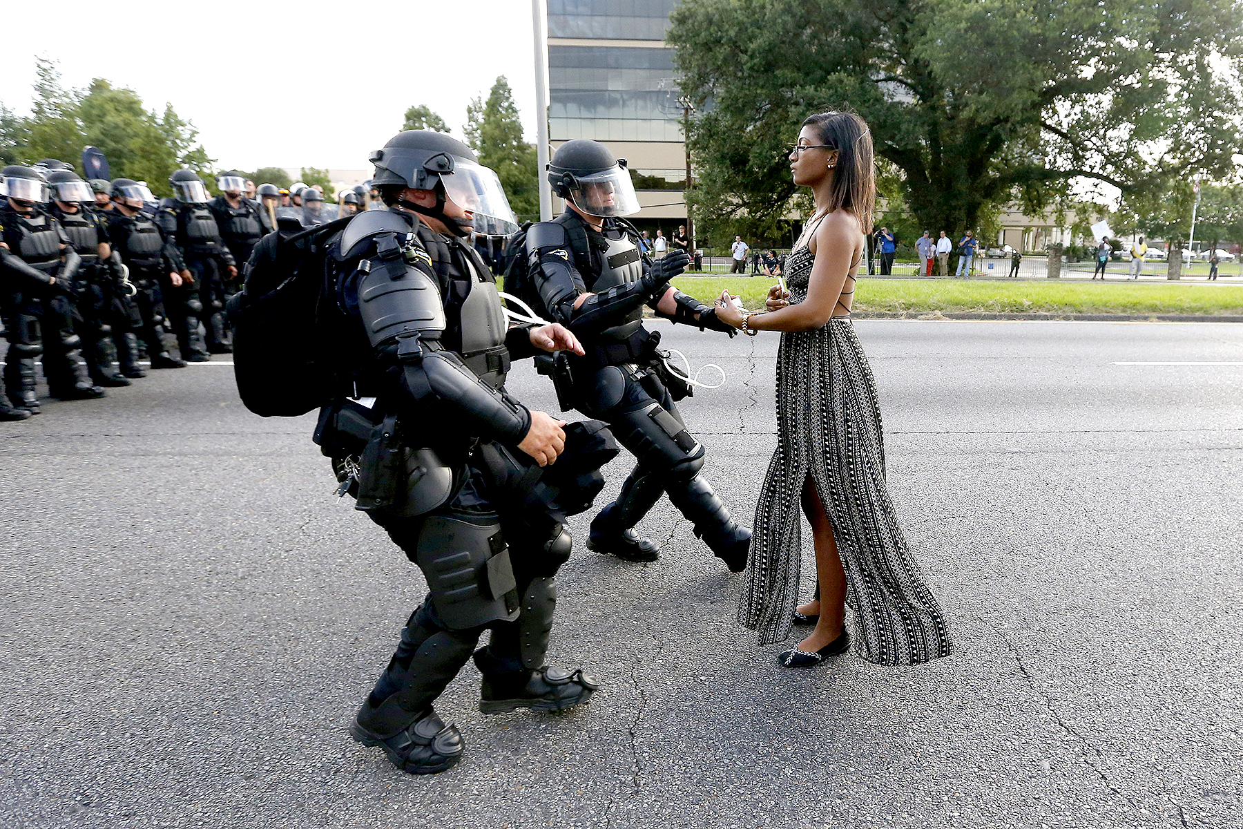 A demonstrator protesting the shooting death of Alton Sterling is detained by law enforcement near the headquarters of the Baton Rouge Police Department in Baton Rouge, Louisiana, U.S. July 9, 2016.