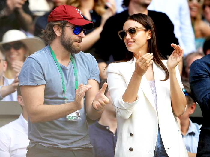 Bradley Cooper and Irina Shayk watch the action on centre court between Roger Federer and Marin Cilic on day nine of the Wimbledon Championships at the All England Lawn Tennis and Croquet Club, Wimbledon in July 2016.