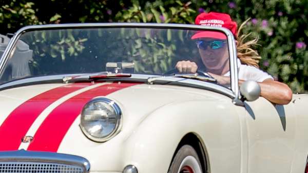 Caitlyn Jenner wears a red 'Make America Great Again' while cruising her classic car in Malibu, CA, August 3, 2017.