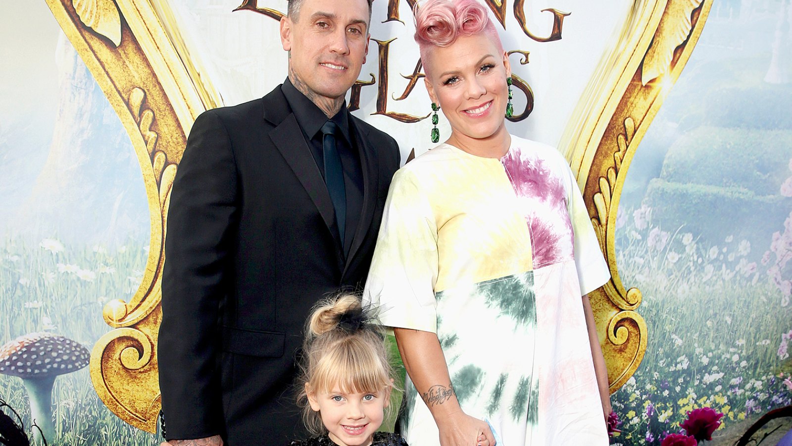 Carey Hart, Willow Sage Hart and singer-songwriter Pink attend the premiere of Disney's "Alice Through The Looking Glass" at the El Capitan Theatre on May 23, 2016.