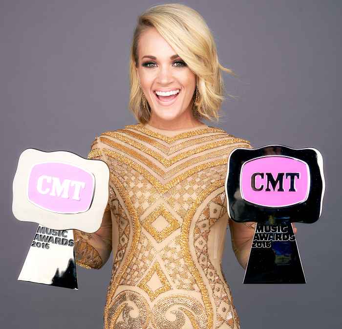 Carrie Underwood poses with her CMT Awards in 2016.