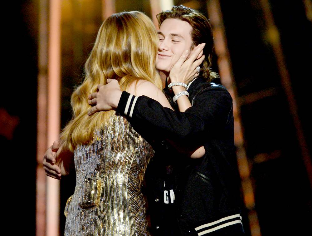Celine Dion accepts the Billboard Icon-Award from son Rene Charles Angelil onstage during the 2016 Billboard Music Awards.