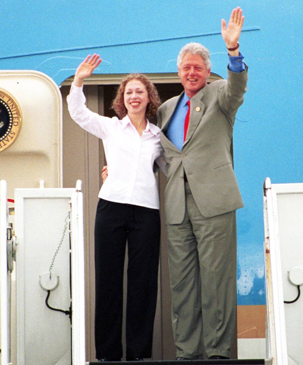 U.S. President Bill Clinton, right, and his daughter Chelsea wave goodbye July 23, 2000