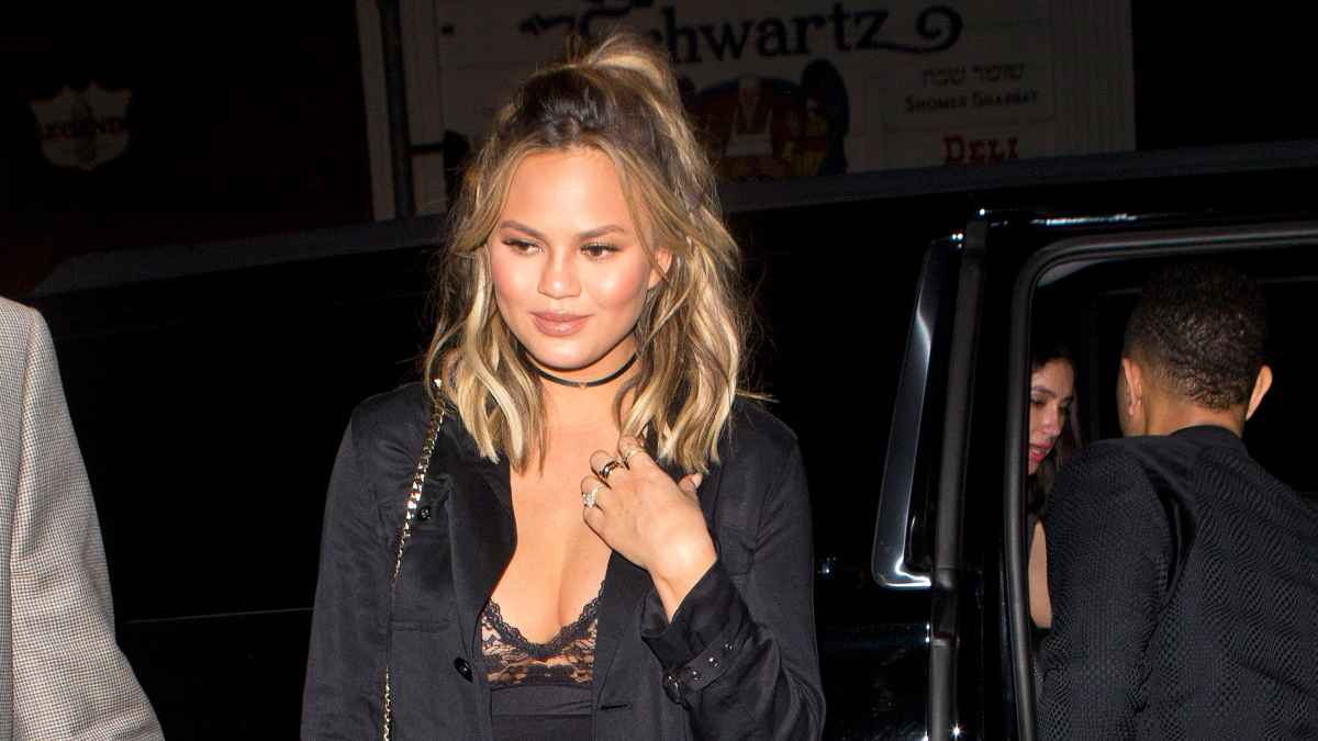 Chrissy Teigen's boobs pop out of skintight catsuit as she struggles  against major wardrobe malfunction - Mirror Online