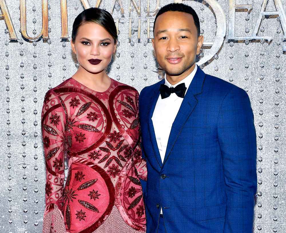 Chrissy Teigen and John Legend arrive at the world premiere of Disney's new live-action "Beauty and the Beast" photographed in front of the Swarovski crystal wall at the El Capitan Theatre on March 2, 2017 in Hollywood, California.