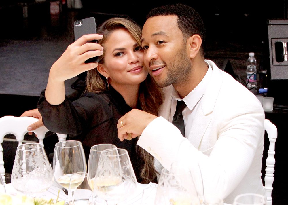 Chrissy Teigen and John Legend attend the White Party Dinner Hosted by Andrea and Veronica Bocelli Celebrating Celebrity Fight Night In Italy Benefitting The Andrea Bocelli Foundation and The Muhammad Ali Parkinson Center on September 5, 2014 at the Bocelli Residence in Forte dei Marme, Italy.