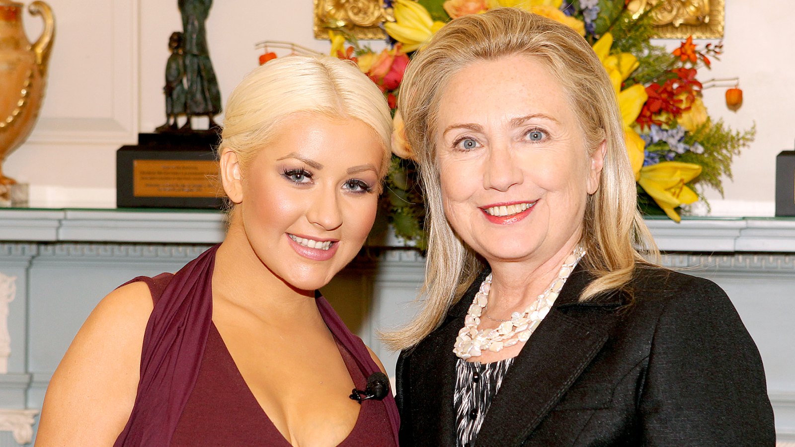 Christina Aguilera and Hillary Clinton pose for a photo at the George McGovern Leadership Award Ceremony where they were honored for their world hunger relief efforts by the World Food Progam at the U.S. State Department in Washington on Wednesday, Oct. 3, 2012.