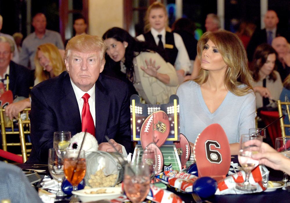 President Donald Trump and first lady Melania Trump attend a Super Bowl party at Trump International Golf Club in West Palm Beach, Fla., Sunday, Feb. 5, 2017.
