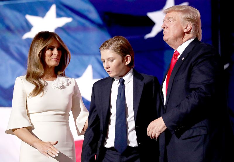 Republican presidential candidate Donald Trump (R) embraces his son Barron Trump, as his wife Melania Trump looks on at the end of the Republican National Convention on July 21, 2016 at the Quicken Loans Arena in Cleveland, Ohio.