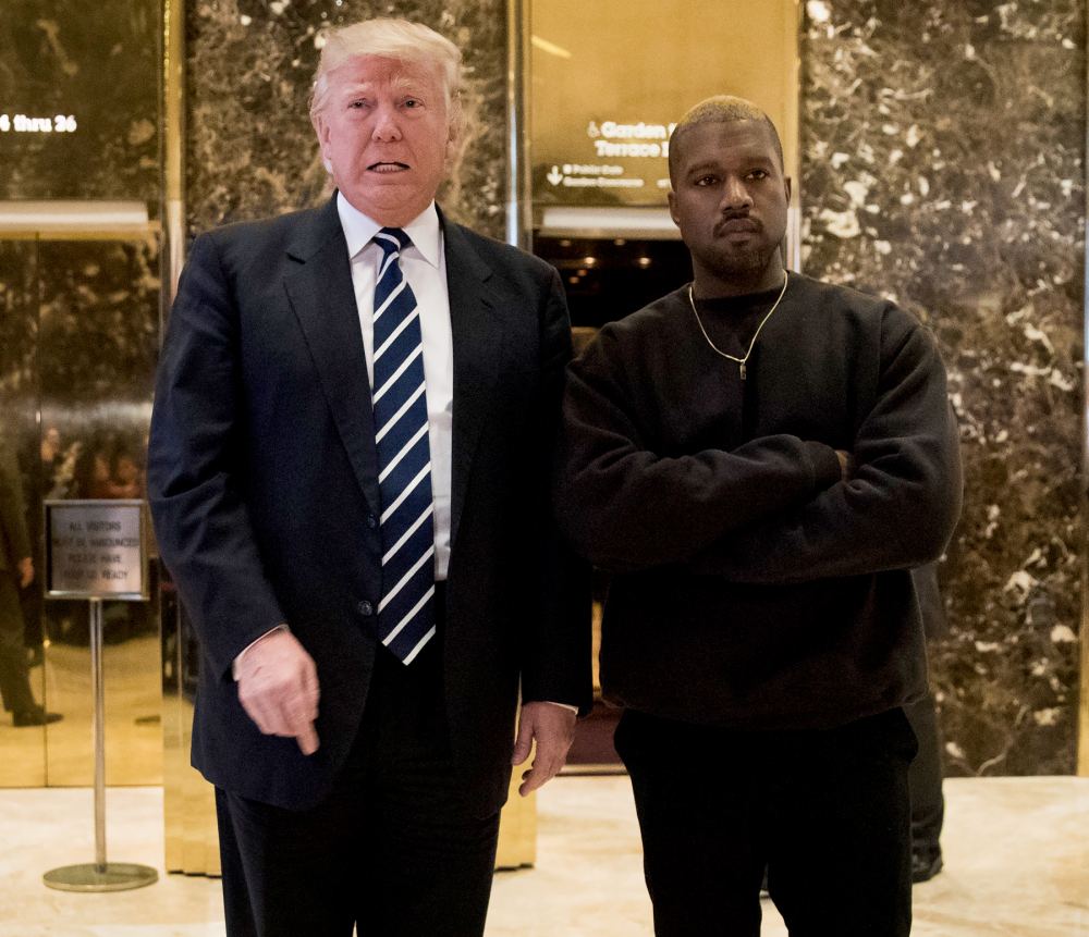 Donald Trump and Kanye West stand together in the lobby at Trump Tower, Dec. 13, 2016, in New York City.