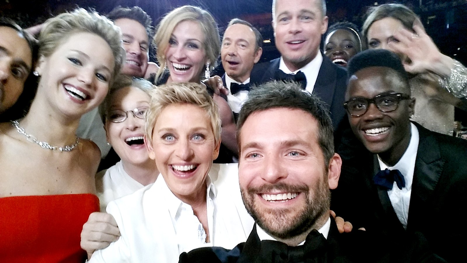 Ellen DeGeneres poses for a selfie taken by Bradley Cooper with (clockwise from L-R) Jared Leto, Jennifer Lawrence, Channing Tatum, Meryl Streep, Julia Roberts, Kevin Spacey, Brad Pitt, Lupita Nyong'o, Angelina Jolie, Peter Nyong'o Jr. and Bradley Cooper during the 86th Annual Academy Awards at the Dolby Theatre on March 2, 2014 in Hollywood, California.