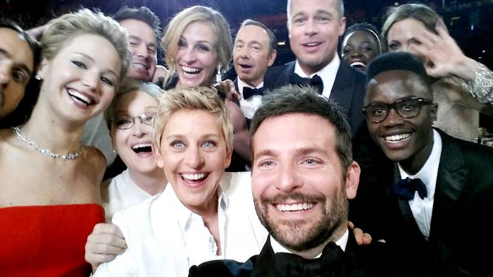 Ellen DeGeneres poses for a selfie taken by Bradley Cooper with (clockwise from L-R) Jared Leto, Jennifer Lawrence, Channing Tatum, Meryl Streep, Julia Roberts, Kevin Spacey, Brad Pitt, Lupita Nyong'o, Angelina Jolie, Peter Nyong'o Jr. and Bradley Cooper during the 86th Annual Academy Awards at the Dolby Theatre on March 2, 2014 in Hollywood, California.