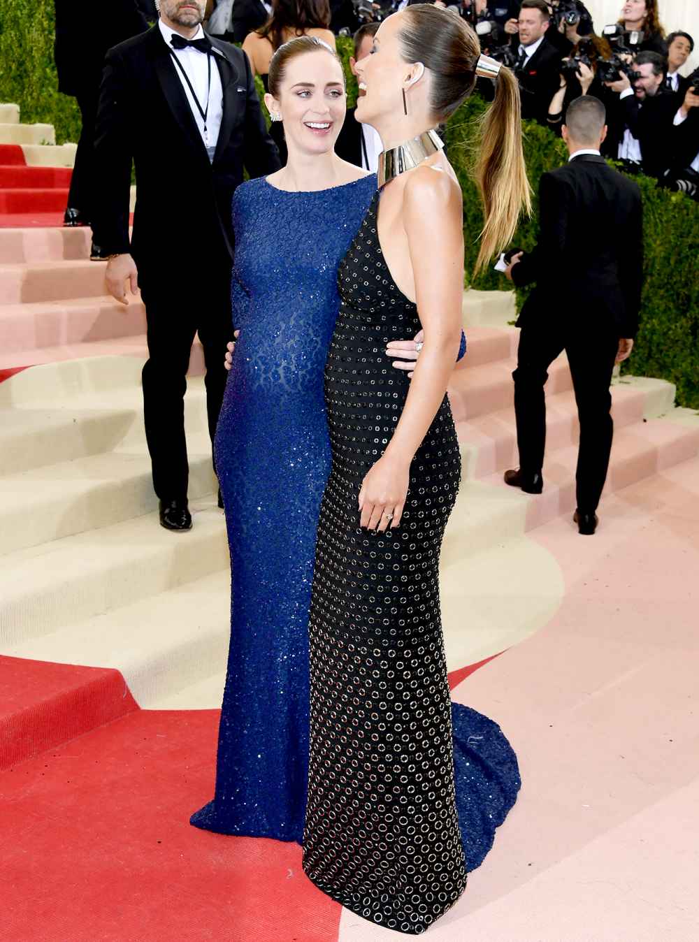 Emily Blunt (L) and Olivia Wilde attend the