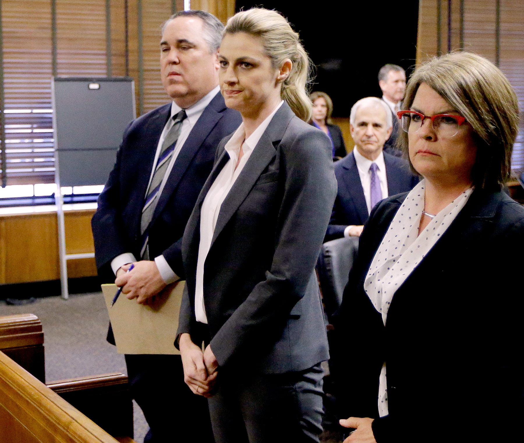 Erin Andrews stands with attorney Scott Carr, second from left, as the jury arrives in the courtroom after reaching a verdict Monday, March 7, 2016, in Nashville, Tenn.