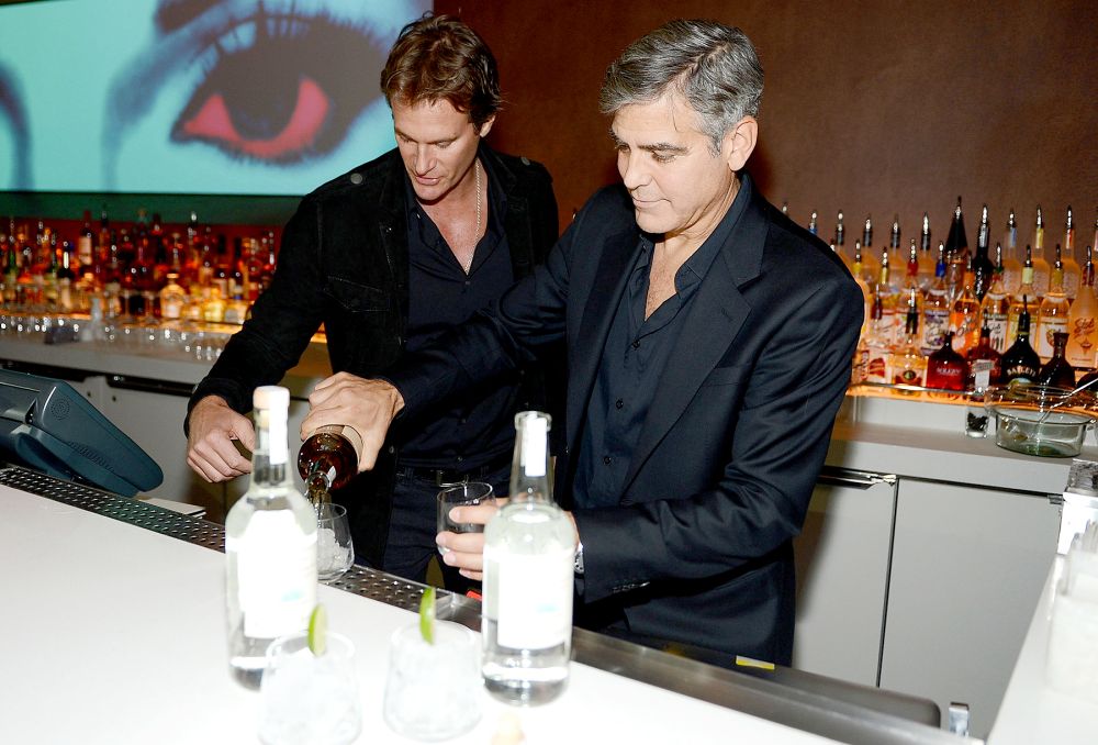 Casamigos Tequila founders Rande Gerber and George Clooney celebrate the launch of Casamigos at Andrea's at Encore Las Vegas on January 9, 2013 in Las Vegas, Nevada.