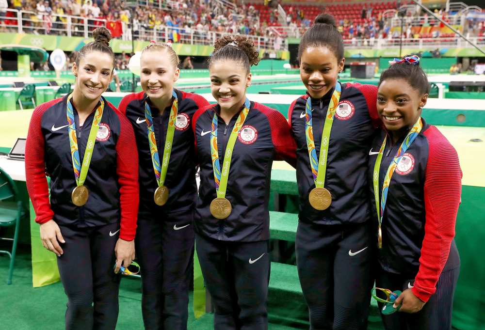 Gold medalists Alexandra Raisman, Madison Kocian, Lauren Hernandez, Gabrielle Douglas and Simone Biles of the United States pose for photographs with their medals after the medal ceremony for the Artistic Gymnastics Women's Team on Day 4 of the Rio 2016 Olympic Games at the Rio Olympic Arena on August 9, 2016 in Rio de Janeiro, Brazil.
