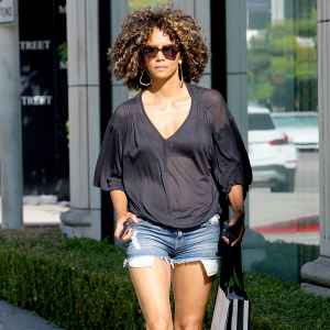 Halle Berry wearing see through shirt and demin short while shopping on Melrose Ave in West Hollywood, August 12, 2017.