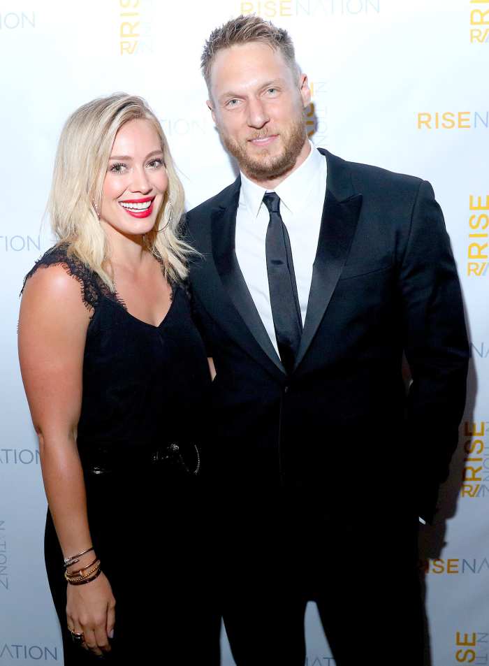 Hilary Duff and personal/celebrity trainer Jason Walsh attend 'Rise Nation Fitness Studio's Los Angeles Grand Opening' on August 21, 2015 in West Hollywood, California.