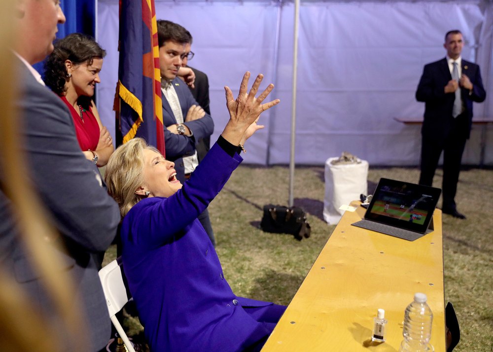 Democratic presidential candidate Hillary Clinton watches the World Series baseball game between the Chicago Cub and the Cleveland Indians after her final campaign rally of the day at Arizona State University in Tempe, Ariz., Wednesday, Nov. 2, 2016.