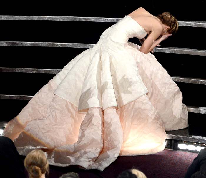 Jennifer Lawrence reacts after winning the Best Actress award for