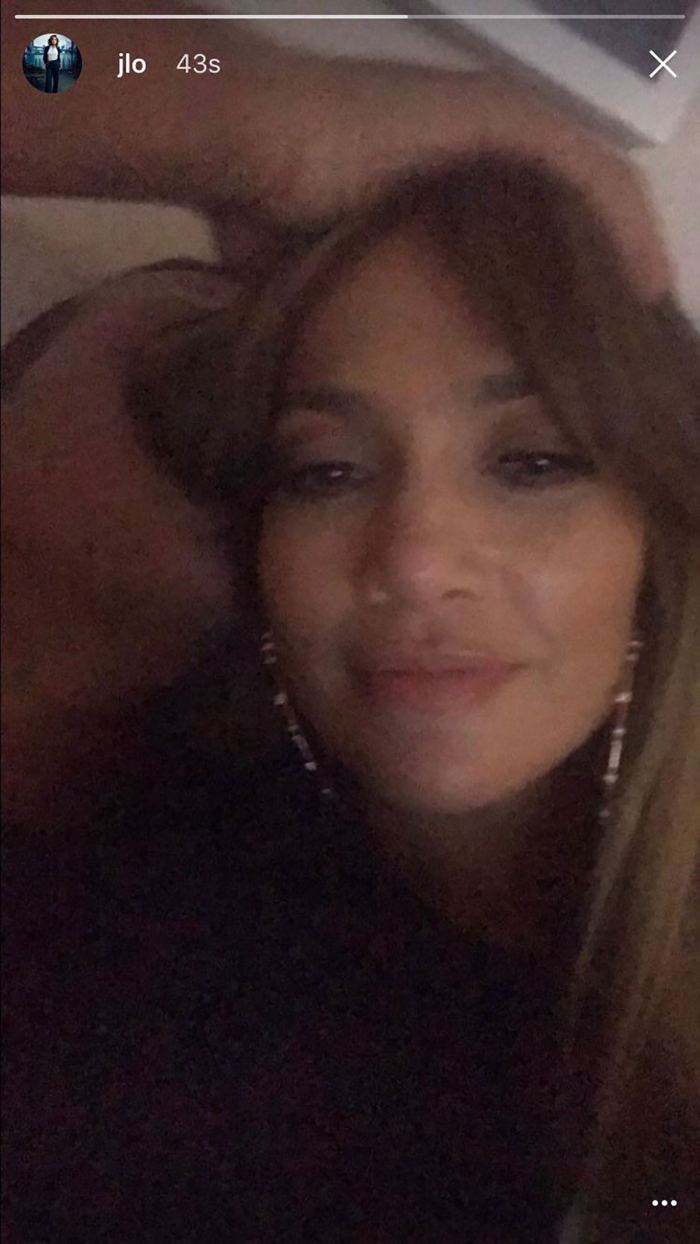Alex Rodriguez appears to be hiding behind Jennifer Lopez's hair in the image the singer shared, but then deleted.