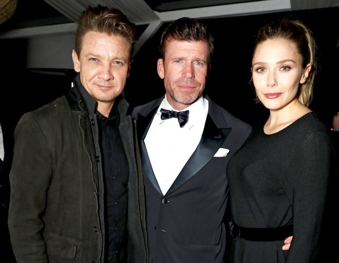 Jeremy Renner, director Taylor Sheridan and Elizabeth Olsen attend The Weinstein Company party in celebration of "Wind River" in association with de Grisogono, Grey Goose Vodka, Hotel de Crillon, and Lexus at Nikki Beach on May 20, 2017 in Cannes, France.