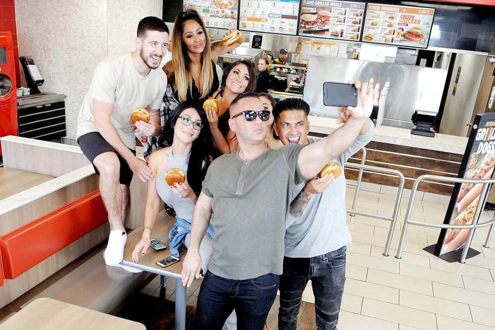 Mike Sorrentino, Nicole Polizzi, Pauly Delvecchio, Jenni Farley, Deena Cortese, Vinny Guadagnino and Sammi Giancola try the new Chicken Parmesan Sandwich at Burger King restaurants on July 11, 2017.