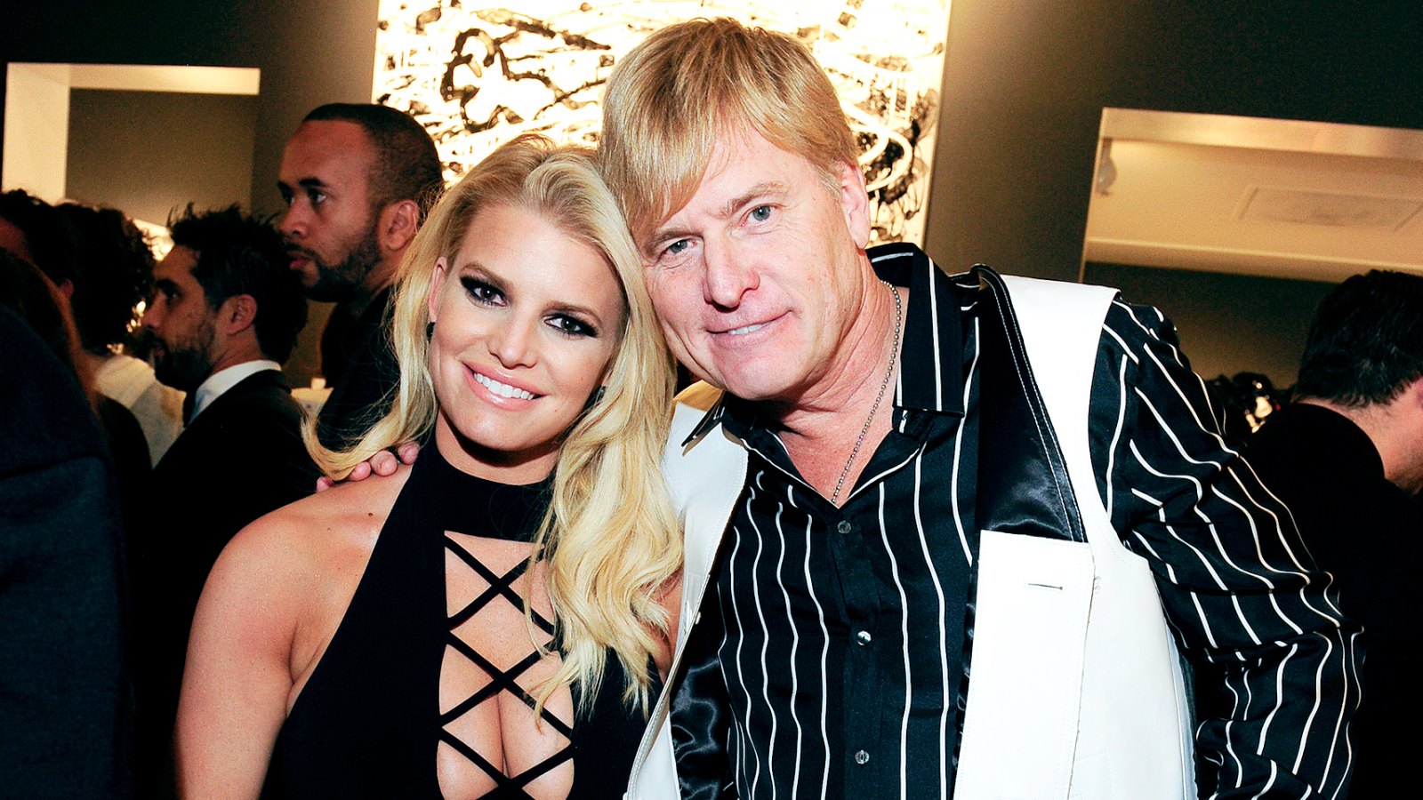 Jessica Simpson and Joe Simpson attend the "Tom Everhart "Raw" Exhibition of His Schulz-influenced Paintings For The First Time In Black And White At Mouche Gallery on February 27, 2016 in Beverly Hills, California.
