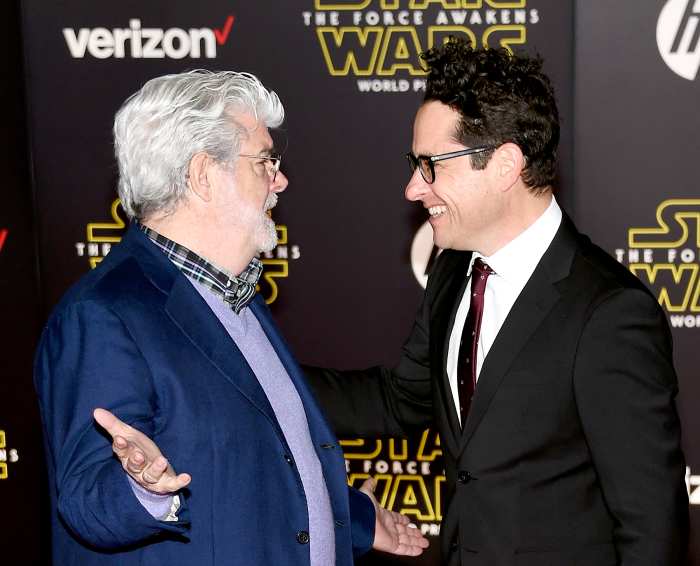 Filmmaker George Lucas and writer-director J.J. Abrams attend the premiere of Walt Disney Pictures and Lucasfilm's Star Wars: The Force Awakens.