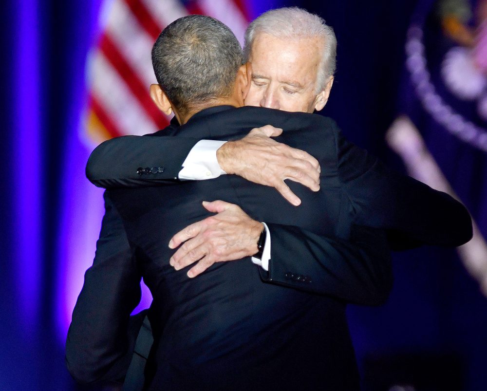 U.S. President Barack Obama, front, embraces U.S. Vice President Joe Biden after his farewell address in Chicago, Illinois, U.S., on Tuesday, Jan. 10, 2017.