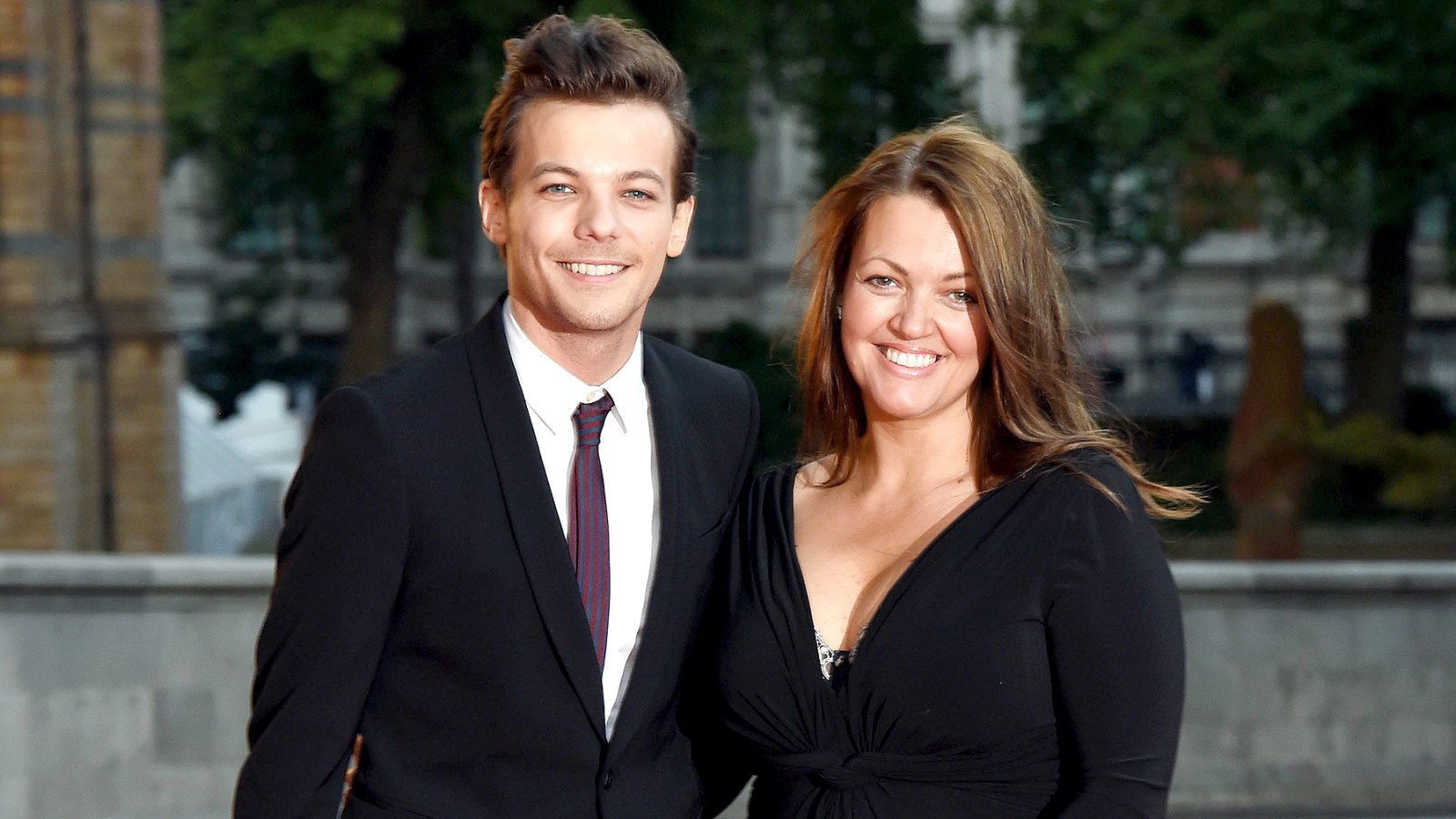 Louis Tomlinson and Johannah Poulston attend the Believe in Magic Cinderella Ball at Natural History Museum on August 10, 2015 in London, England.