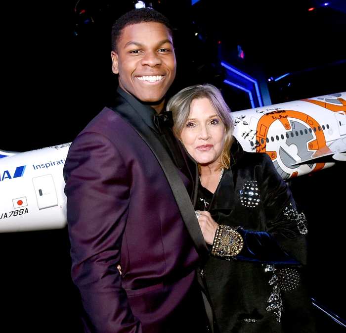 John Boyega and Carrie Fisher attend the world premiere of