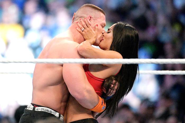 WWE Superstars John Cena, left, and Nikki Bella kiss after she accepted his marriage proposal during WrestleMania 33 on Sunday, April 2, 2017, in Orlando, Fla.