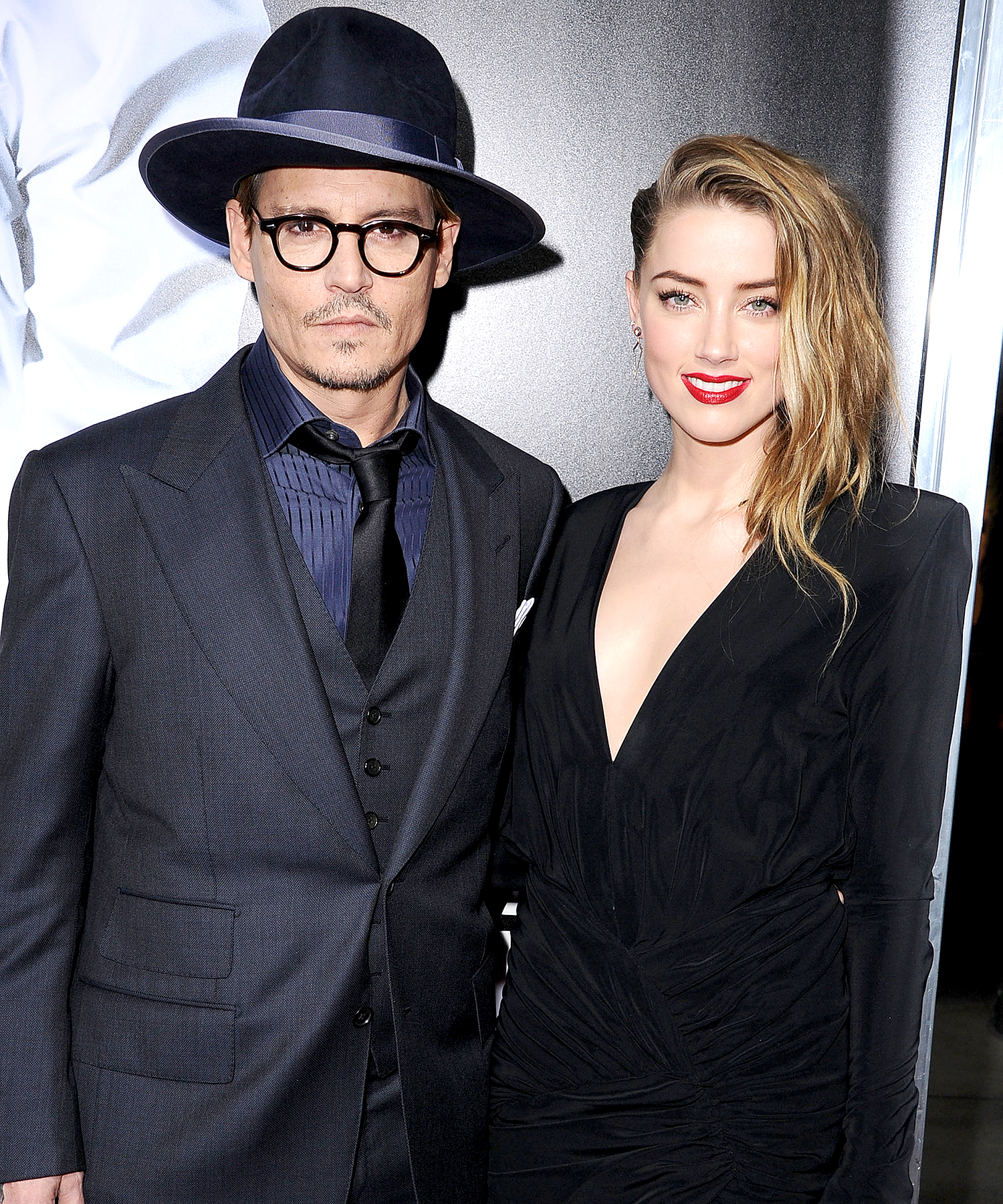 Johnny Depp and Amber Heard arrives at the "3 Days To Kill" at ArcLight Cinemas on February 12, 2014 in Hollywood, California.