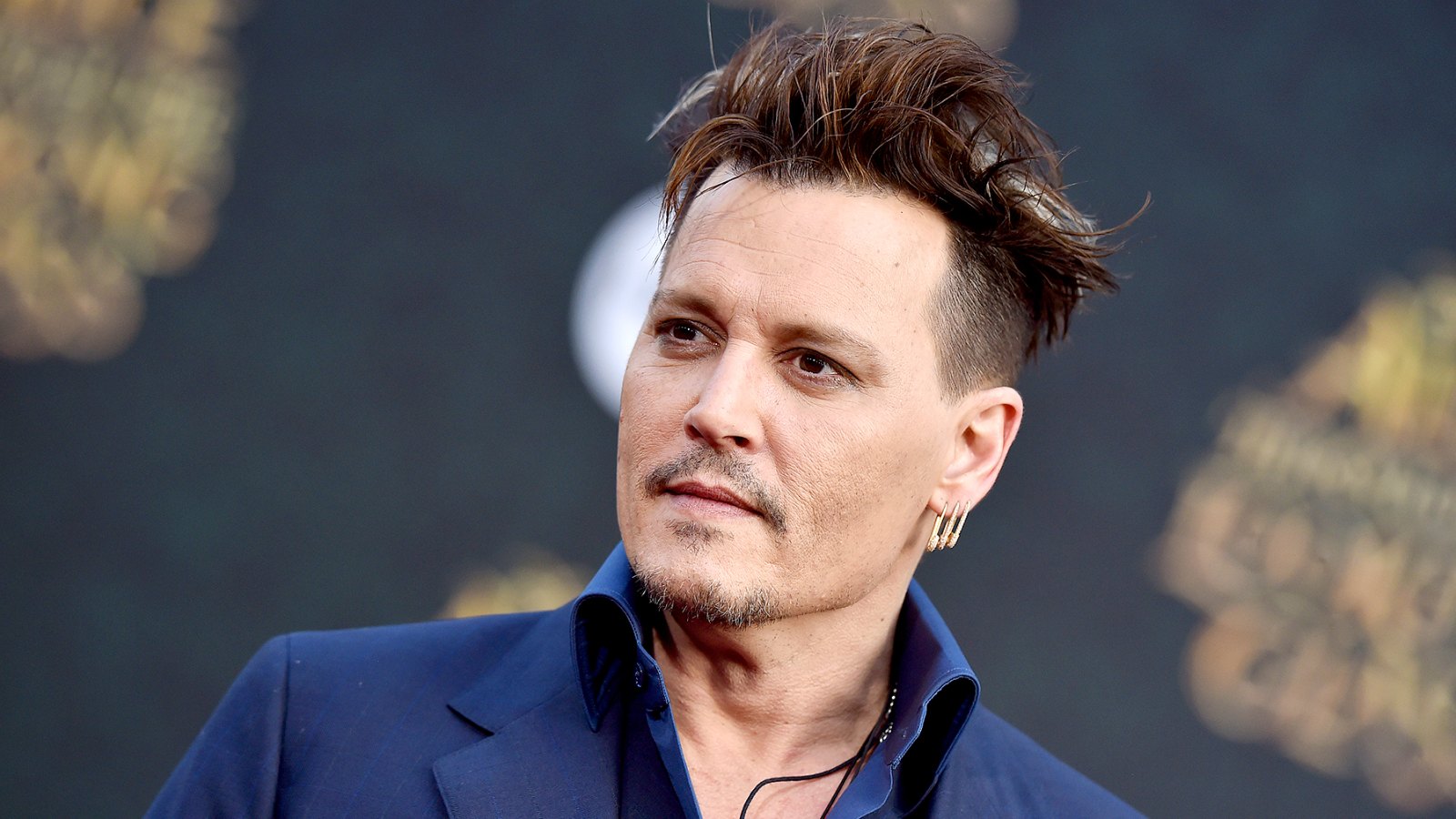 Johnny Depp arrives at the premiere of Disney's 'Alice Through The Looking Glass' at the El Capitan Theatre on May 23, 2016 in Hollywood, California.