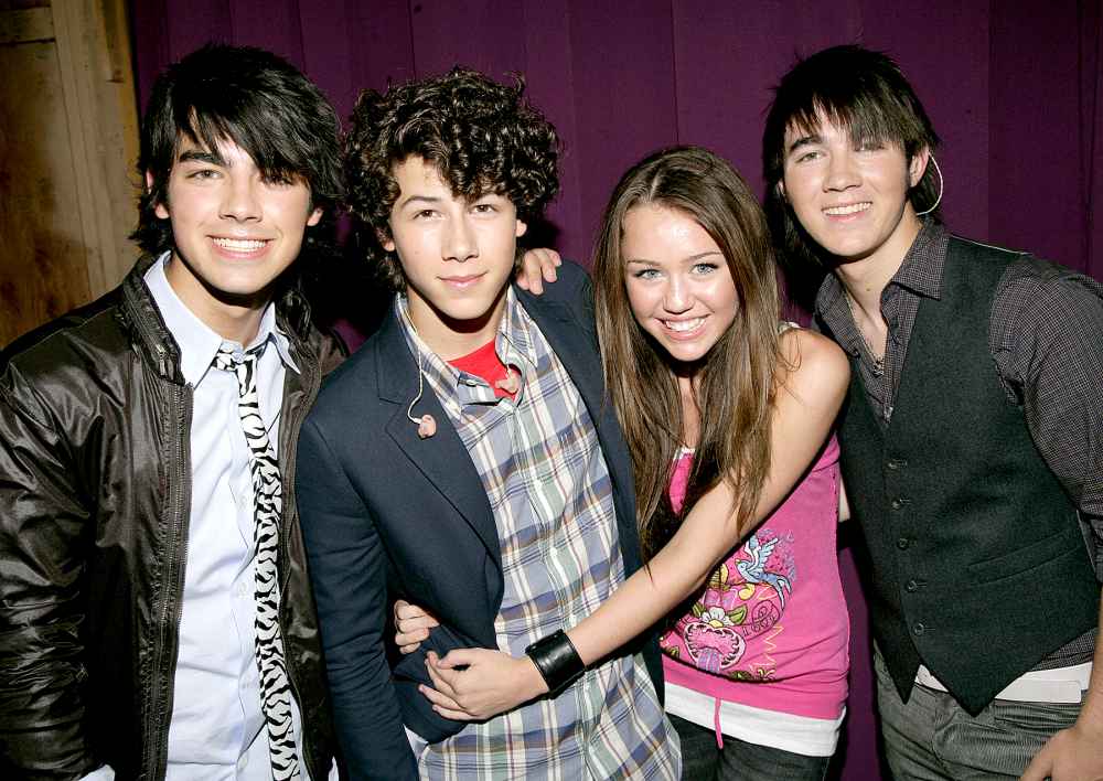Joe Jonas, Nick Jonas, Miley Cyrus and Kevin Jonas in 2007.