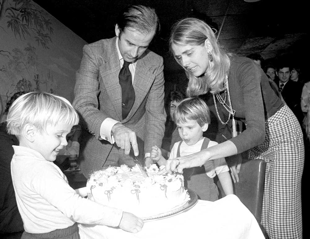 Senator-elect Joseph Biden and wife Nelia cut his 30th birthday cake at a party in Wilmington, November 20th. His son, Hunter waits for the first piece. Biden by becoming 30 fulfills the constitutional requirement of Senators being 30 years of age when they take office.