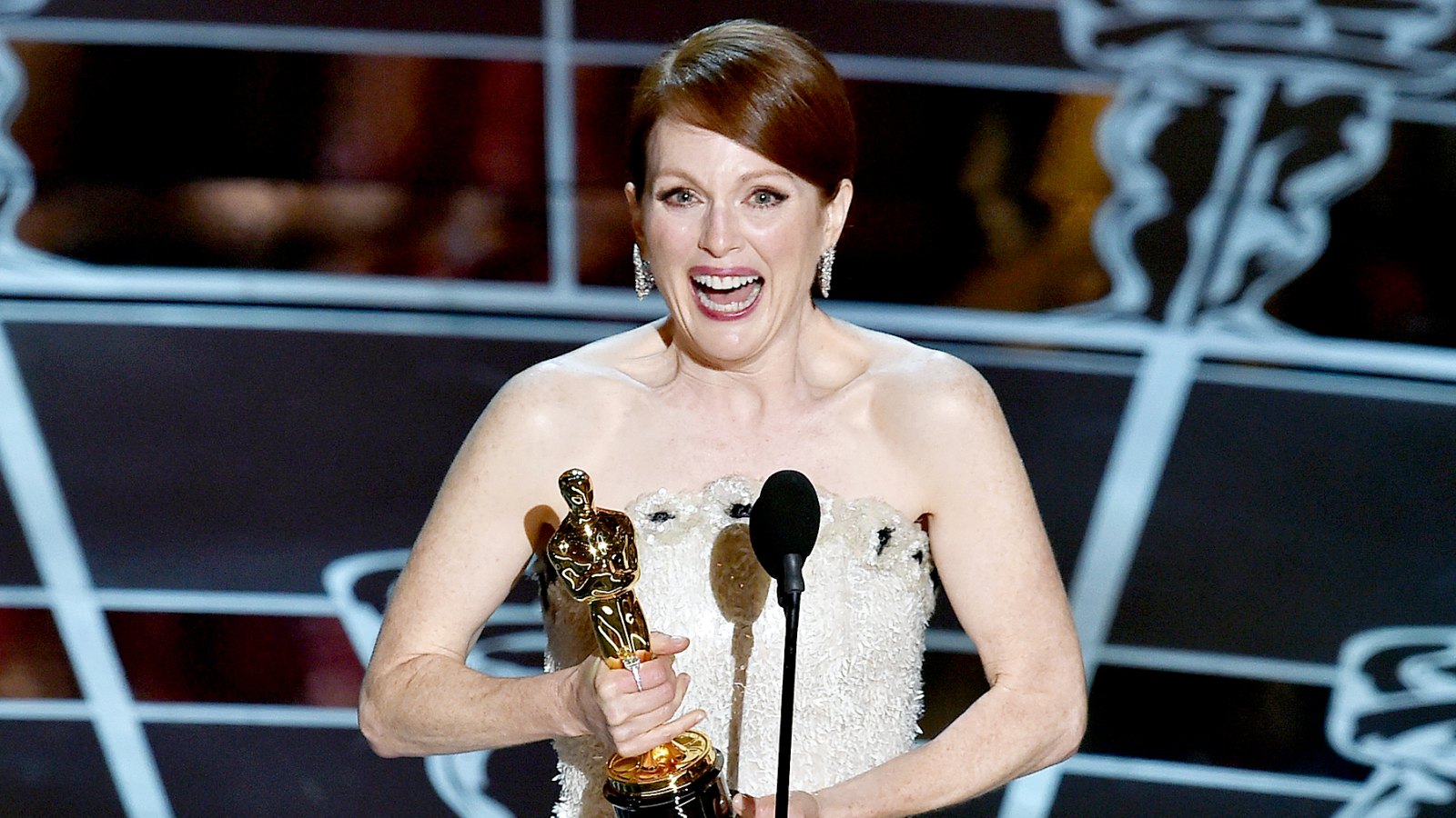 Julianne Moore accepts the Best Actress in a Leading Role award for 'Still Alice' on stage during the 87th annual Academy Awards.