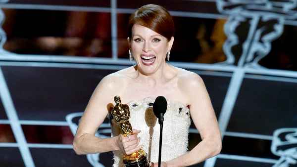 Julianne Moore accepts the Best Actress in a Leading Role award for 'Still Alice' on stage during the 87th annual Academy Awards.