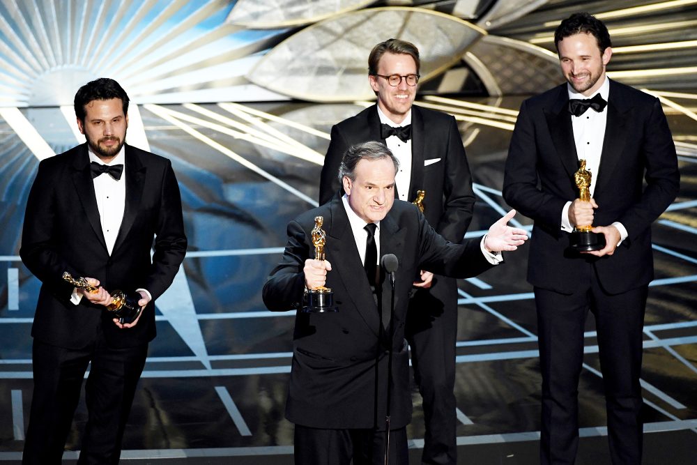 Robert Legato (at microphone) and (L-R) Adam Valdez, Andrew R. Jones, and Dan Lemmon accept Best Visual Effects for 'The Jungle Book' onstage during the 89th Annual Academy Awards at Hollywood & Highland Center on February 26, 2017 in Hollywood, California.