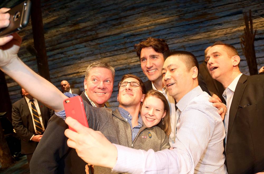 Canadian Prime Minister Justin Trudeau poses for a selfie with the crew backstage at the hit musical "Come from Away" on Broadway at The Schoenfeld Theatre on March 15, 2017 in New York City